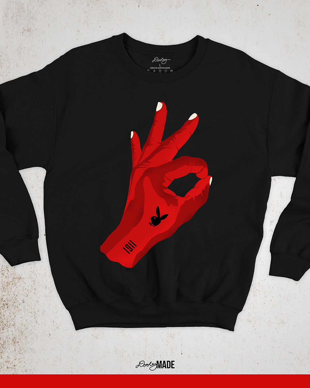 An image of a black Kappa Alpha Psi Fraternity, Inc. crewneck sweater featuring a large red Yo hand sign. There is a bunny and 1911 on the hand in black.