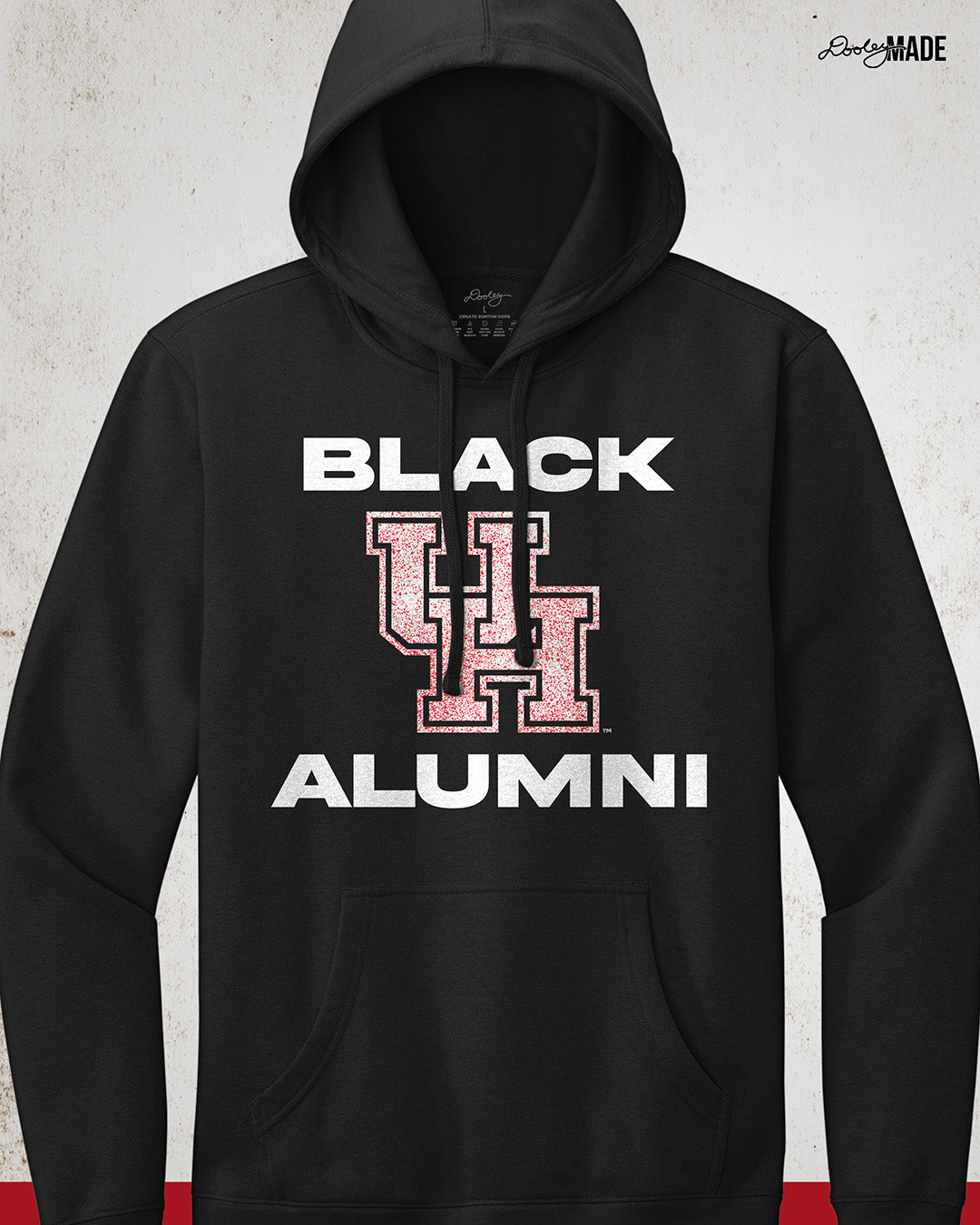 Image of a black "Black UH Alumni Hoodie with bold, white text reading "BLACK ALUMNI" surrounding a speckled red "UH" logo in the center. The design highlights pride and unity for Black Alumni of the University of Houston, presented on a modern and stylish garment perfect for showing school spirit.